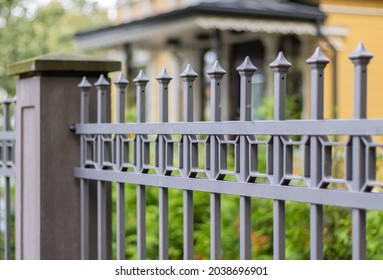 Top Of Forged Metal Fence And Concrete Pillar