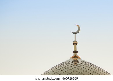 The Top Of The Golden Minaret With The Symbol Of Islam Is The Growing Moon Of The Golden Crescent Moon. Right In The Frame.