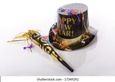 Top Hat That Says Happy New Year And Other Party Favors Isolated Against White Background