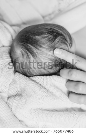 Similar – Baby sleeping on a blanket