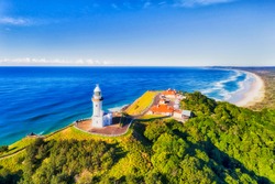 The Top Of Headlands At Byron Bay With Famous White Lighthouse Of The Most Eastern Point Of Australian Continent Overlooking Pacific Ocean And Wide Sandy Beaches.