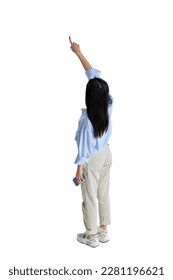 Top isometric back view of young girl in formal wear, shirt pointing with finger on illusion screen isolated over white studio background. Concept of business, education. lifestyle. Copy space for ad