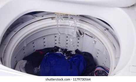 Top Load Washing Machine With Clothes Loaded To Be Cleaned