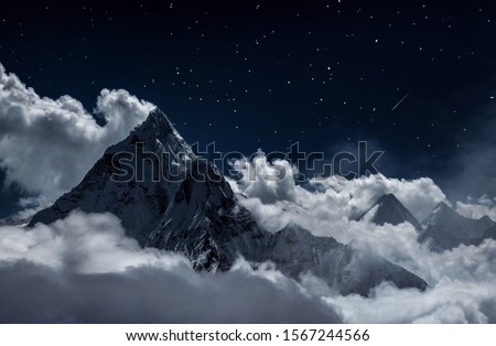 Top of mount Ama Dablam in the clouds at night, Nepal, digital edited image