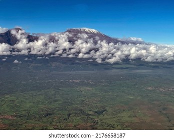 The Top Of Mount Kilimanjaro Is Shrouded In White Clouds. Bird's Eye View