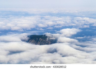Top of mountains in clouds