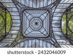 The top of the neo-Gothic steel gate of the church of Saint Nicholas, located in the center of Szewna.The dome of a beautiful historic and unusual church gate made of steel, cast iron and glass - 1895