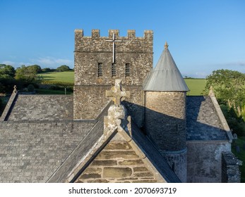 Top Of Old Church Building With Christian Cross At Avon Gifford Church In Devon, UK