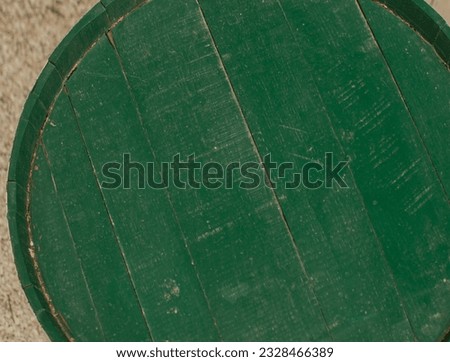 Top of old wooden green barrell - close up with wood and paint, space for copy or product