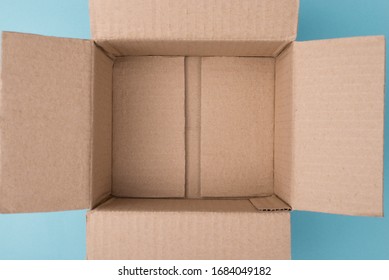 Top Overhead Above Closeup View Photo Of Unpacked Empty Box On Blue Background With Blank Copy Space