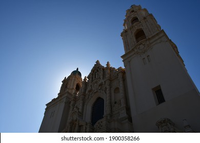 Top Part Of The Facade Of The Mission Dolores Basilica In San Francisco, Seen From Below, Against A Blue Sky