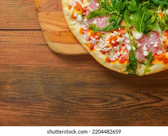 Top Quality Uncooked Italian Pizza With Spinach And Meat On A Wooden Tray And Table. Cook At Home Product. Top Range Ingredients. Classic Meal. Top Down View. Copy Space