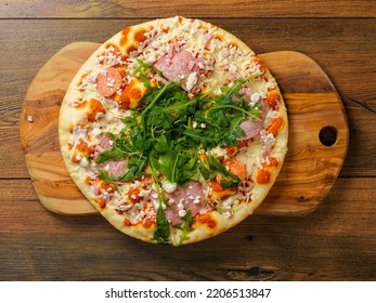 Top Quality Uncooked Italian Pizza With Spinach And Meat On A Wooden Tray And Table. Cook At Home Product. Top Range Ingredients. Classic Meal. Top Down View.