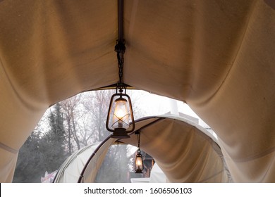 Top of a rustic chuck wagon with a lantern in the center - Powered by Shutterstock