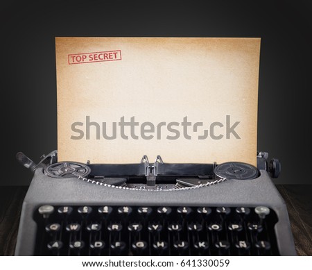 Top secret document in old typewriter.