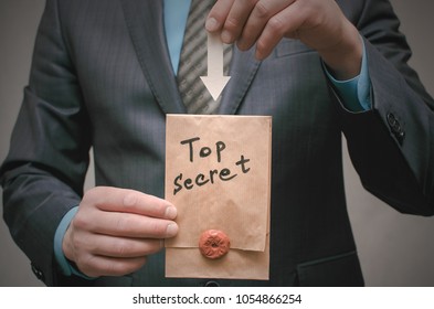 Top Secret Documents Presentation Concept. Top Secret Message In Detective Spy Agent Hands. Confidential Dossier Information. Super Important Information.