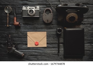 Top Secret Letter In Envelope On Flat Lay Detective Agent Desk Background.