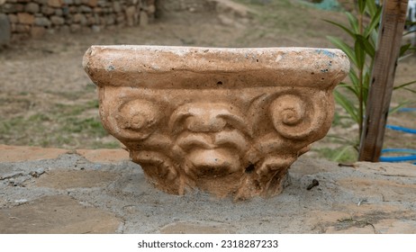 top section of ancient greek column found in the garden of a house. 