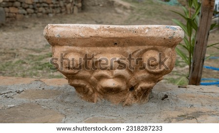 top section of ancient greek column found in the garden of a house. 