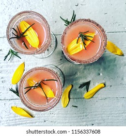 Top Shot Of A Group Of Grapefruit & Rosemary Cocktails; Margaritas Or Salty Dogs.