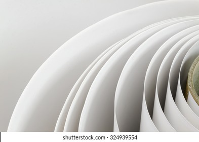 Top shot macro Paper roll swirl in a printshop, horizontal