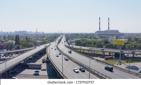 top shot of a modern industrial motor vehicle interchange with overpasses and bridges. part on reconstruction with speed limits to a minimum. aerial view