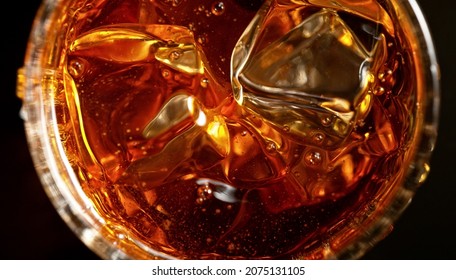 Top Shot Of Whisky Glass With Ice Cubes, Closeup. Isolated On Black Background.