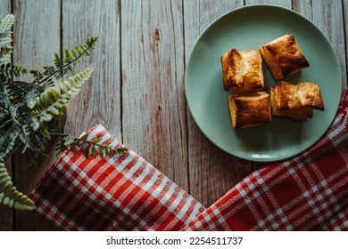 Top and side view of puffed pastry and cheese or Greek yogurt on wooden background  - Shutterstock ID 2254511737