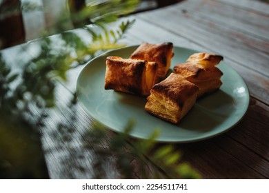 Top and side view of puffed pastry and cheese or Greek yogurt on wooden background  - Shutterstock ID 2254511741