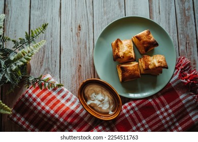 Top and side view of puffed pastry and cheese or Greek yogurt on wooden background  - Shutterstock ID 2254511763
