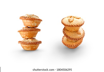 Top and side view of traditional Christmas pies with sweet mince filling isolated against a white background.