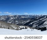 Top of snowy mountains at Beaver Creek Resort in Colorado with blue skies