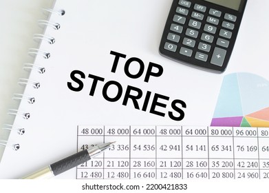 Top Stories Text Message On Notepad Background