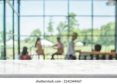 Top table with bokeh light blur restaurant. Marble empty table in front of blurred background. White marble granite over blur in coffee shop and kitchen - can be used for display or montage products. - Shutterstock ID 2141344567