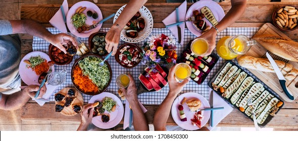 Top Vertical View Of Table Full Of Food And Drinks And Happy People Friends Celebrating And. Enjoy Together Eating And Having Fun - Concept Of Social Distance And  Lifestyle At Home With Parents