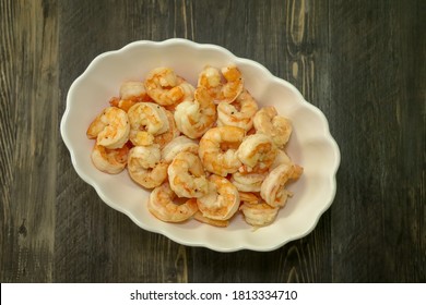 Top View Of 16-20 Size Shrimp Cooked With Garlic And Butter And Fresh Ground Pepper.  