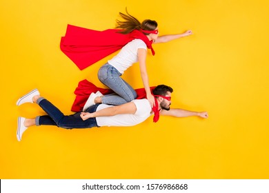 Top view above high angle flat lay flatlay lie view concept of her she his he focused strong successful people flying to goal isolated on bright vivid shine vibrant yellow color background