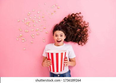 Top View Above High Angle Flat Lay Flatlay Lie Concept Portrait Of Her She Nice Lovely Funny Cheerful Wavy-haired Girl Eating Corn Having Fun Watching Movie Isolated On Pink Pastel Color Background