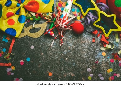Top view of accessories for carnival and birthday with copy space over grunge background. Carnival celebration concept