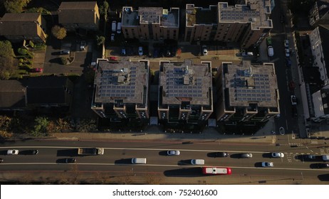 Top View Aerial Drone Image Of A Rooftop Covered With Solar Panels In London, England, UK.