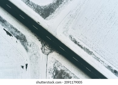Top View Aerial Of Empty Asphalt Road Through Countryside In Winter, Drone Photography