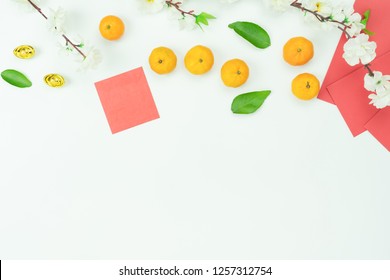 Top View Aerial Image Shot Of Arrangement Decoration Chinese New Year & Lunar New Year Holiday Background Concept.Flat Lay  Orange With Red Pocket Money On Modern White Wooden At Home Office Desk.