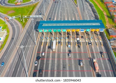 Top View Aerial Overloaded Toll Road Or Tollway On The Controlled Access Highway, Forced Traffic Jam