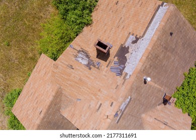 Top View From An Aerial Perspective Of Destroyed Roof Shingles Caused By Strong Winds And Strong Storms