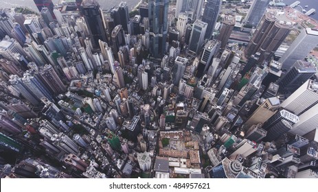 Top view aerial photo from flying drone of a big China town with skyscrapers roofs and business centers. Big city with advanced buildings infrastructure, tall office skyscrapers, streets and roads