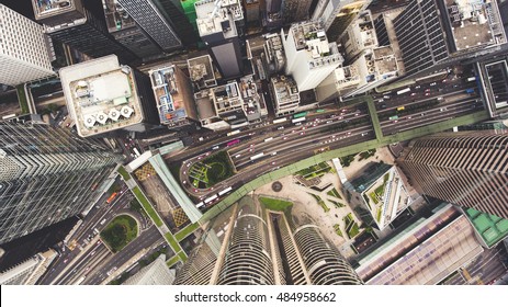 Top view aerial photo from flying drone of a developed Hong Kong city with modern skyscrapers with contemporary design. China town with business and financial centers and road with cars - Shutterstock ID 484958662