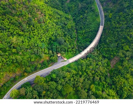 Top view Aerial photo from flying drone over The highest bridge pier Phor Khun Pha Muang Bridge (Huai Tong at Phetchaboon Thailand.Bridge over the jungle.Bridge over mountain and green forest