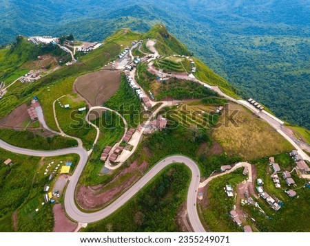 Top view Aerial photo from flying drone over Mountains and winding road mountain paths exciting steep at Phu Thap Boek ,Phetchabun Province,Thailand,ASIA.