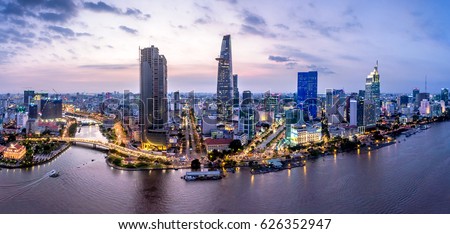 Top view aerial photo from flying drone of a Ho Chi Minh City with development buildings, transportation, energy power infrastructure. Financial and business centers in developed Vietnam.