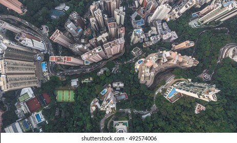 Top View Or Aerial Shot Of Skyscrapers And Green Trees In A Big City. Hong Kong, China.